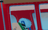 The original: the thin blue window frames are crisp against the red paint.